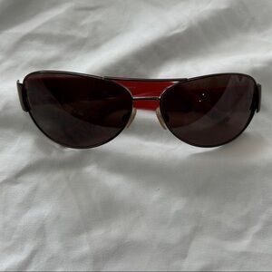 Polo Ralph Lauren orange/tortoise 3049 sunglasses. Minor scratch on right frame.